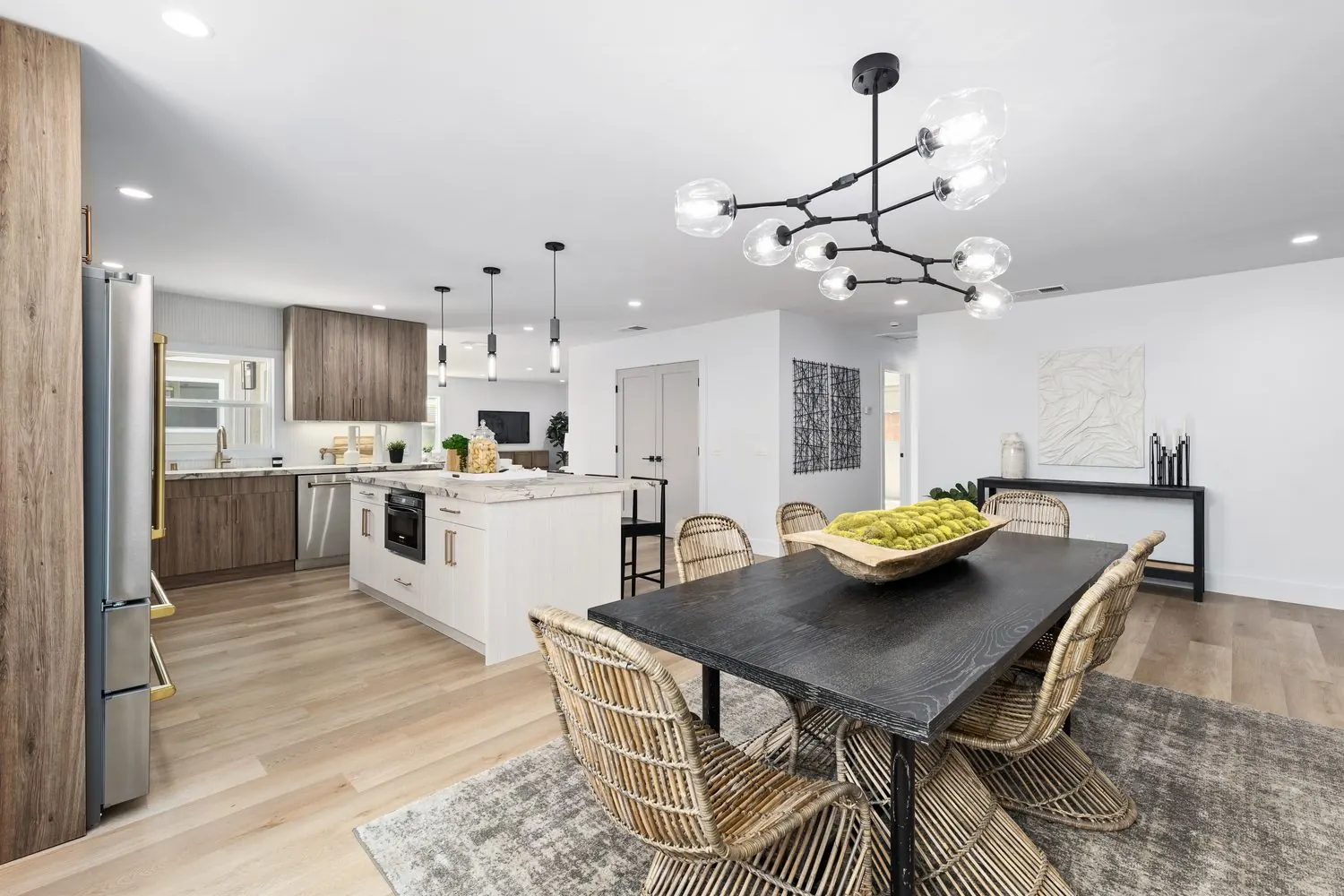 Open-plan kitchen and dining remodel in Long Beach by Girl Flip Construction, featured on HGTV