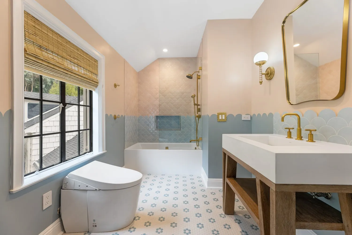 Scalloped-tile bathroom remodel by Girl Flip Construction