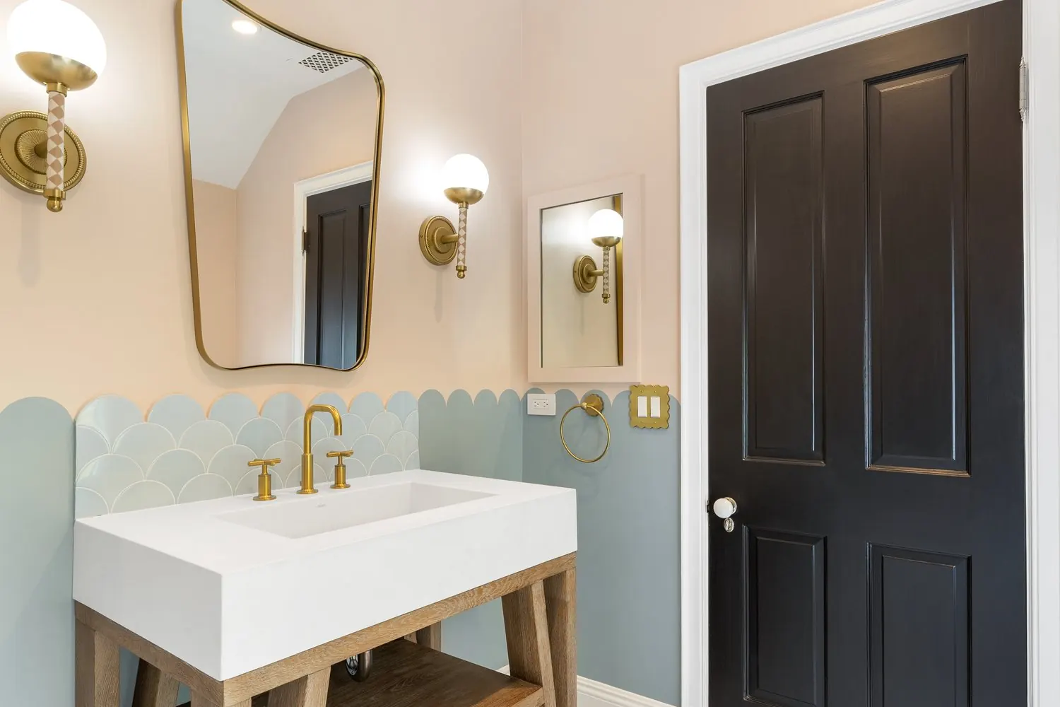 Brass fixtures and vanity in a bathroom remodel